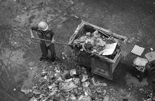 Construction workers managing waste removal on a Fitzrovia site